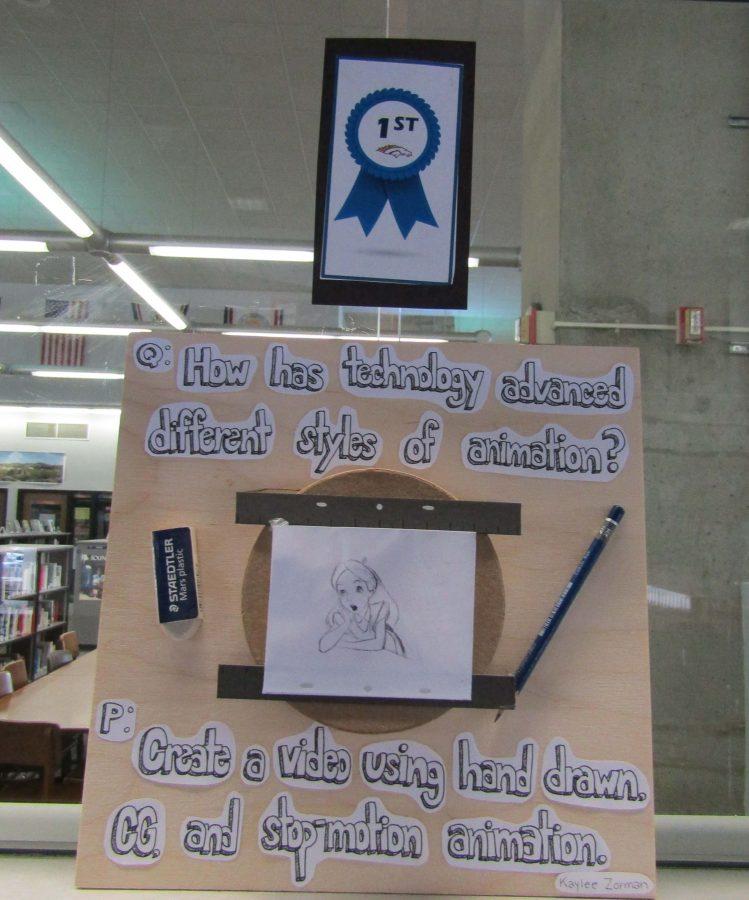 Senior Kaylee Zorman wins first prize for her senior project board displayed outside of the library.