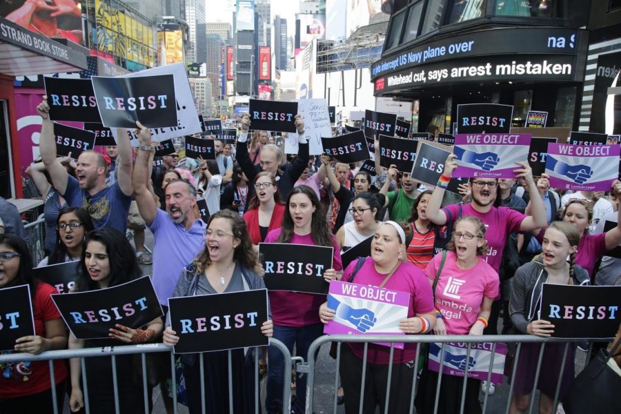 Demonstrators+gather+at+Times+Square+in+New+York+City+to+protest+the+ban+issued+by+President+Trump+on+July+26+that+bars+transgender+soldiers+from+serving+in+the+Armed+Forces