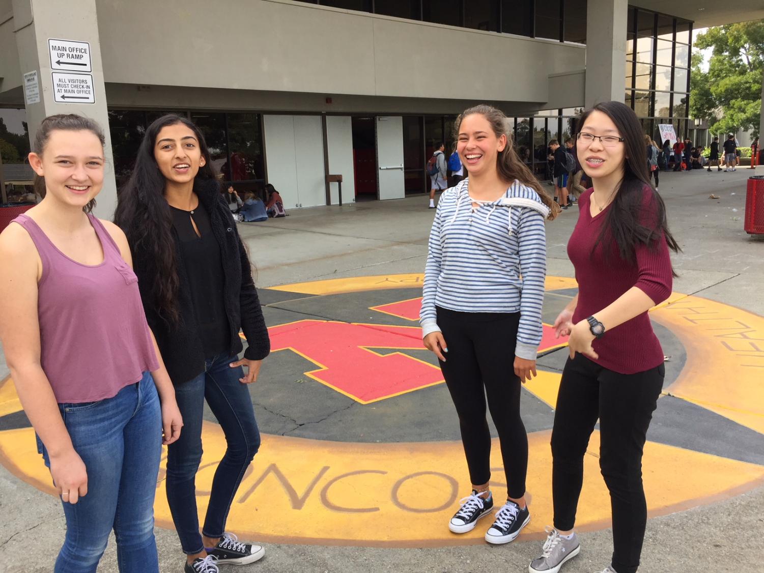 Sophomores Maggie Levy, Stuti Pradhan, Katerina Stahl, and Jennifer Yee, who regularly eat lunch together in front of the new compass mural, say they enjoy the outdoor art.