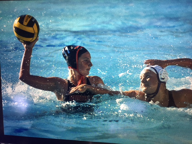 Varsity water polo player Naomi Jenkins looks to score against an Amador Valley defender in  September.