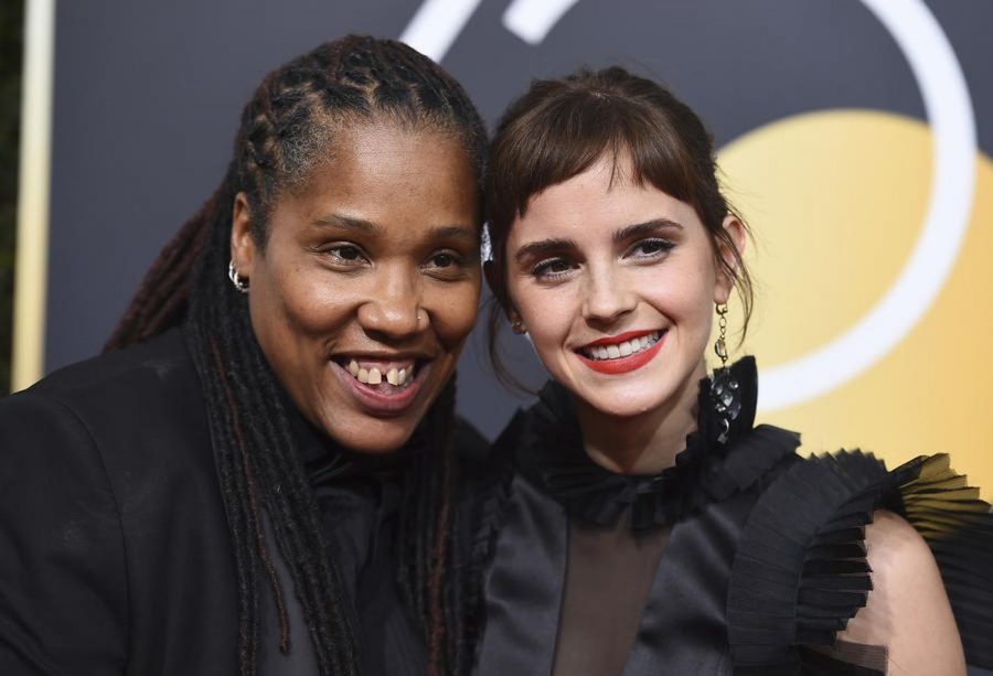 British feminist Marai Larasi (left) with Emma Waston wear black in support of the Times Up movement at the 2017 Golden Globe Awards.