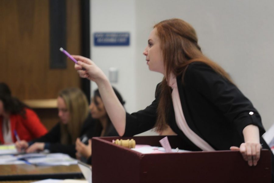 Caitlin Reimer, the President Pro Tem of one of Northgates five student senates, calls on a speaker during during the annual December Mock Congress.