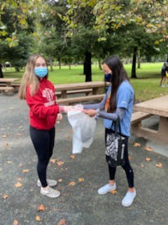 Megan Briggs and Cady Chan, sophomore members of the Plastic Pollution Cleanup Club, help the environment at an Oct. 24 cleanup at Concord Community Park.
