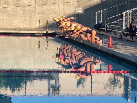 Junior varsity girls water polo players don’t pause for reflection as they start their practice Nov. 3, one of many Northgate sports camps underway since late summer as teams await a delayed start to the fall sports season. 
