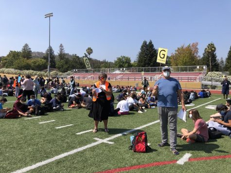 Nothing says school is in session quite like a fire drill, which occurred Aug. 24. German teacher Nancy Grabow and biology teacher Paul Gundelfinger monitor their students as more than 1,600 students and staff converge on the sports stadium to rehearse the drill at the end of second period. 