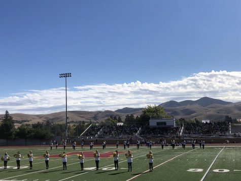 Students and staff gather at the sports stadium Sept. 10 for the first rally in nearly two years with juniors and seniors, pictured in background, on the home side of the field and freshmen and sophomores, not in picture, on the visitors side of the field.