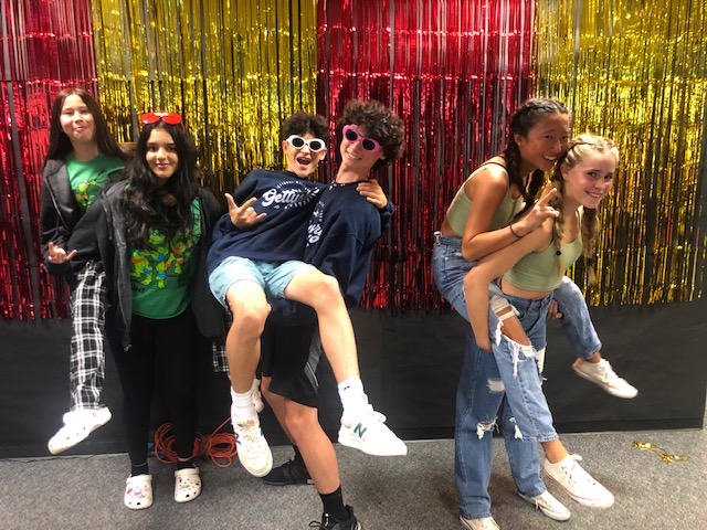 Three sets of twins on Co-Stars Day: Freshmen from left to right: Elizabeth Meyer on the back of Alana Manan, Babak Okhravi held by Zeon Hubp and twins with braids Sara Yoo and Nora Vonberg enjoyed Spirit Weeks Twin Day Sept. 20.