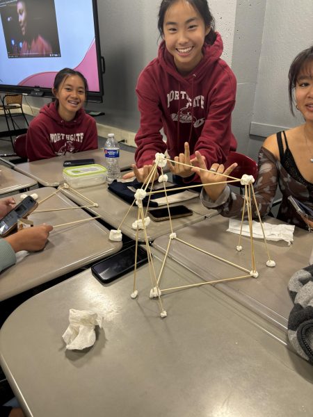 Seniors Tien Nguyen, Ariel Ng, and Allison Nguyen show off their structure they made alongside friends Carmen Urmson, Siya Majumdar, Alison Lancaster, and Michaela Young at the Northgate Engineering Basics meeting on Sept. 19 